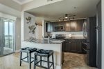 Fully stocked kitchen to prepare a culinary feast with stainless steel appliances and granite countertops. 